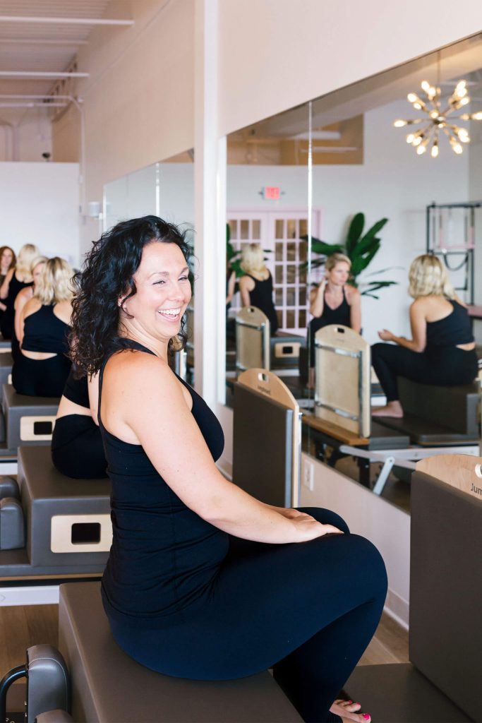 A woman smiling while seating